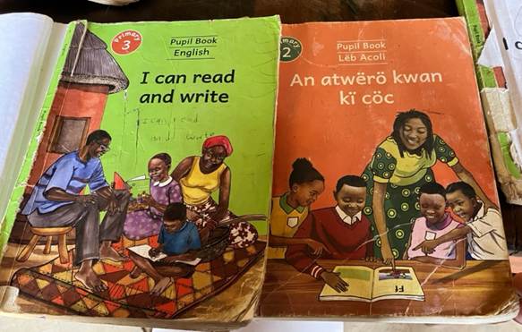 Figure 1. A group of children's books in English and Acholi.
