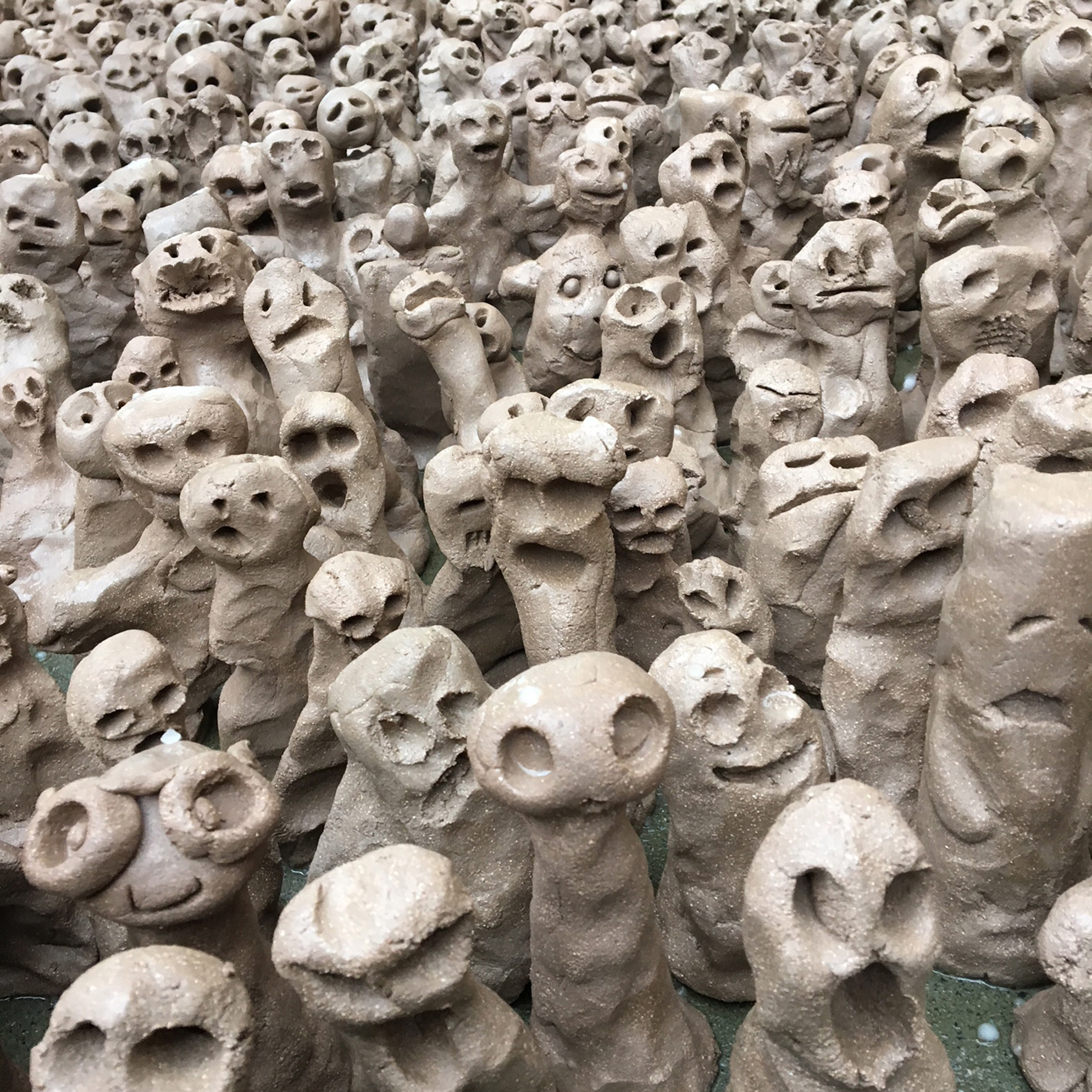 Many small clay figures