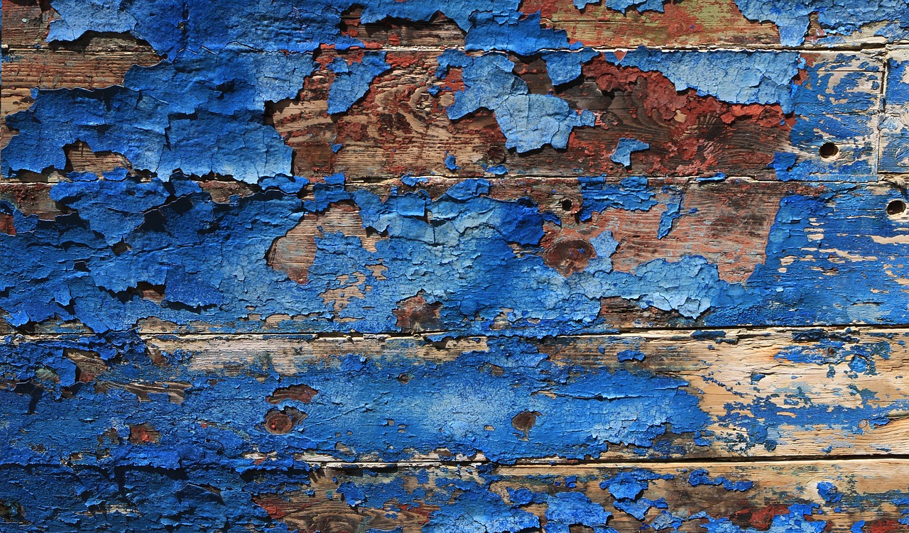 Texture background of blue-cracked wood as a metaphor for the idea of "public secrets"