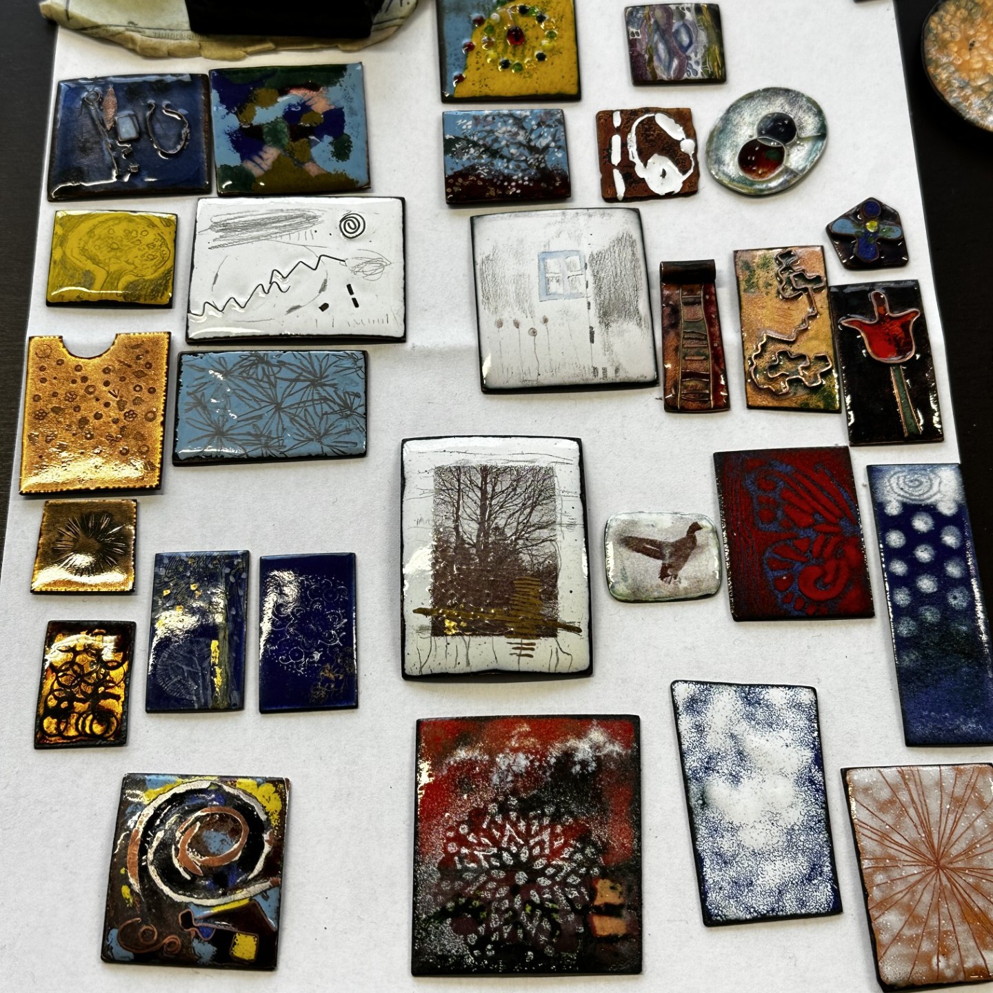 Several small pictures of enamel work 